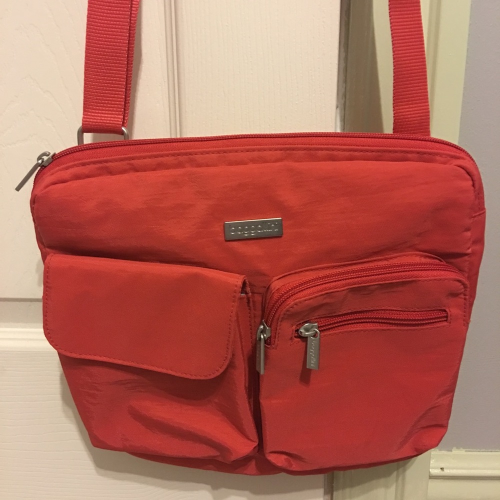 Coral color Baggallini crossbody/shoulder bag.